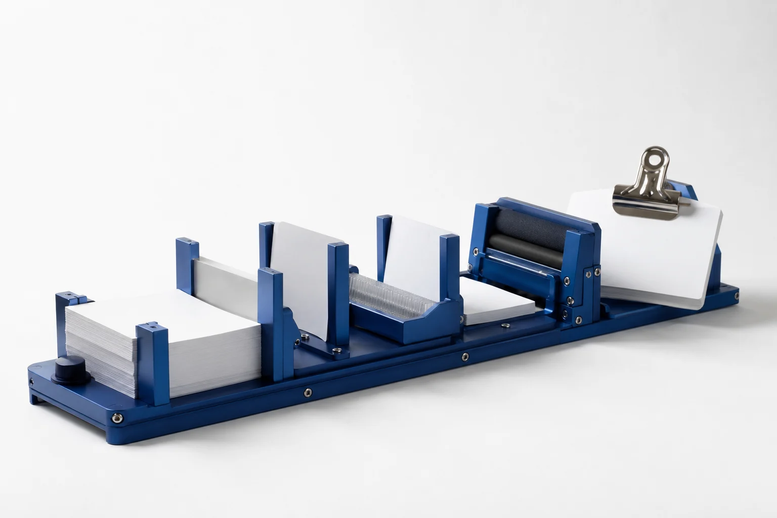 A cobalt desktop tool moves white source cards through a sequence of work stations.